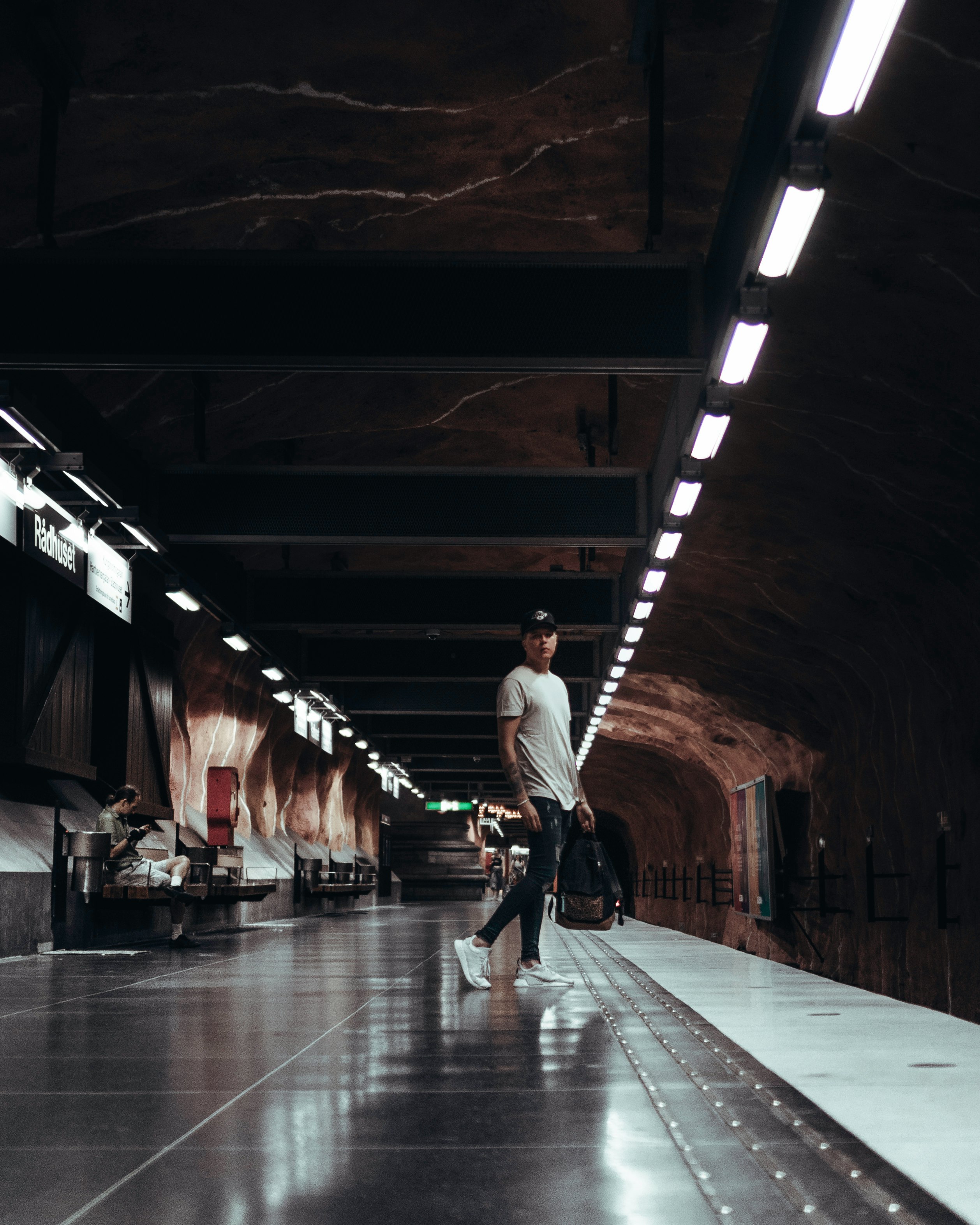 man standing on subway